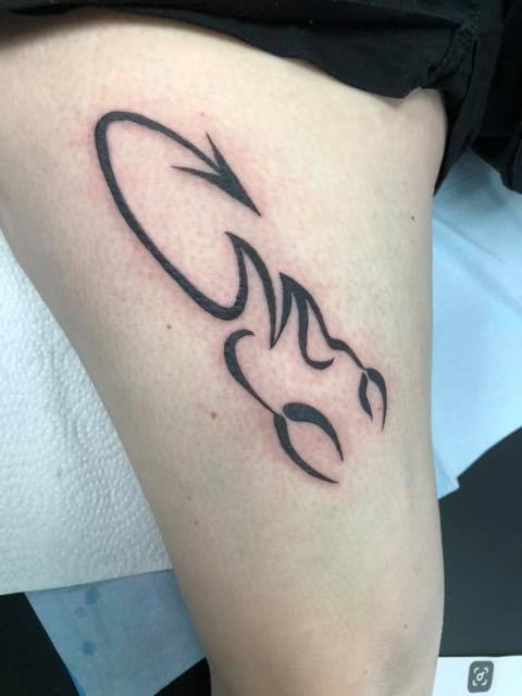 Alluring Thigh Tattoos For Scorpio Ladies