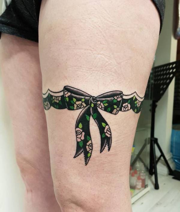  Bow Wraparound Tattoos On Thigh