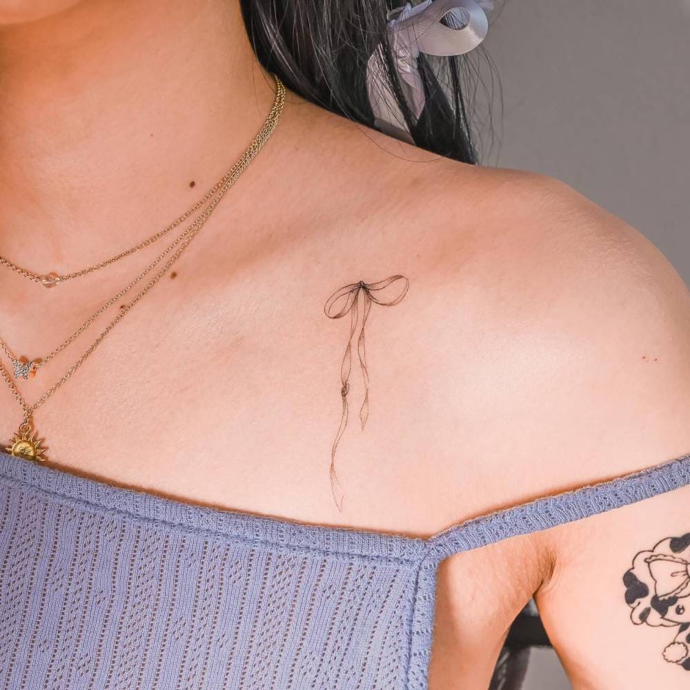 Dainty Bow Inks On Collarbone