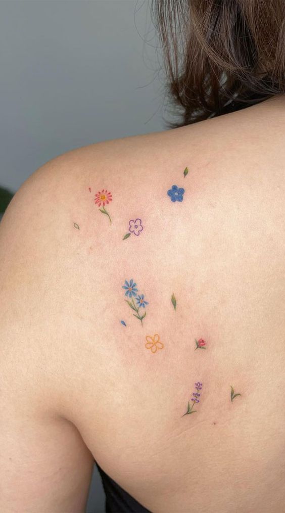 Multiple Colorful Flower Tattoos