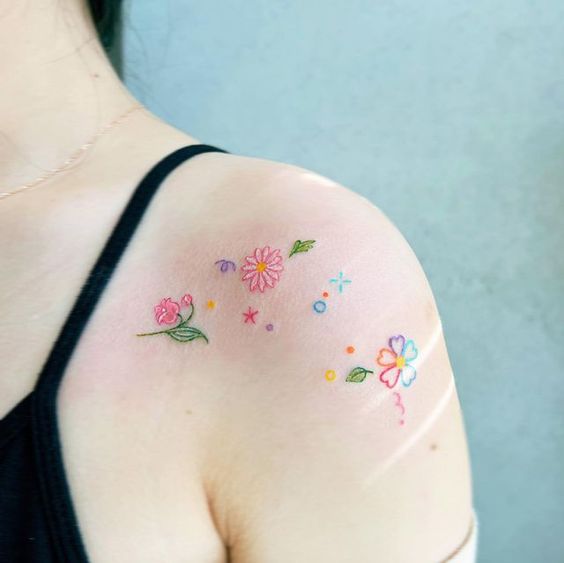 Multiple Colorful Flower Tattoos