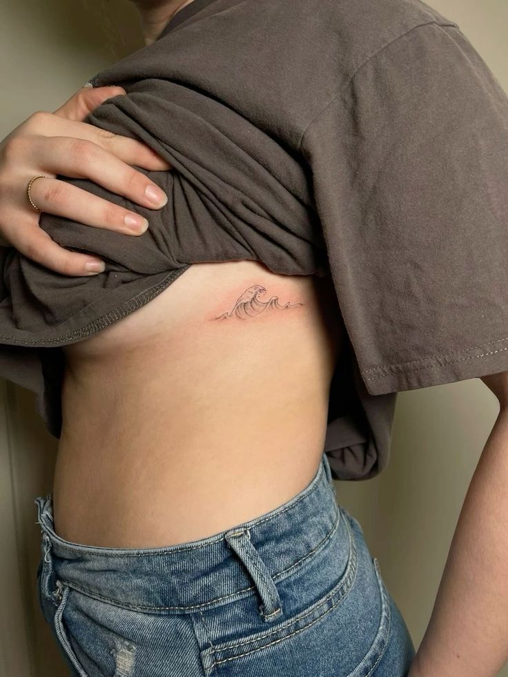 Sea Wave Tattoos On Rib