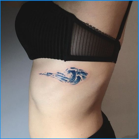 Sea Wave Tattoos On Rib