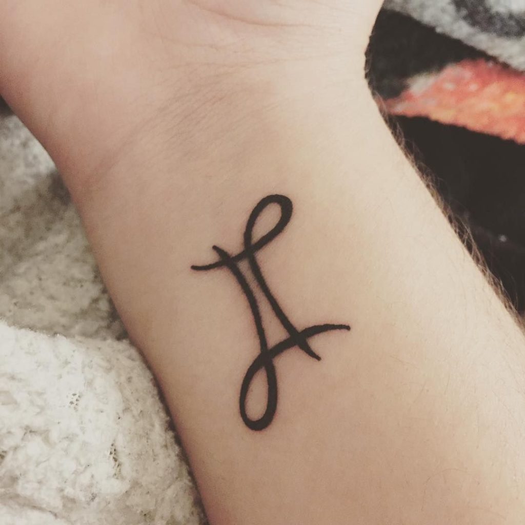 Stylized Gemini Symbol On Wrist