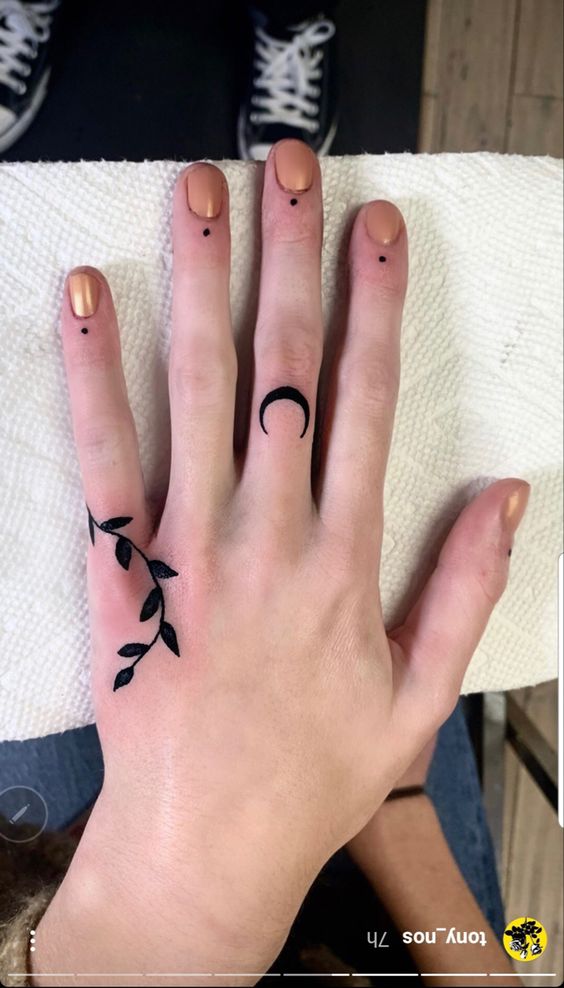  Black Moon And Leaf Hand Tattoo