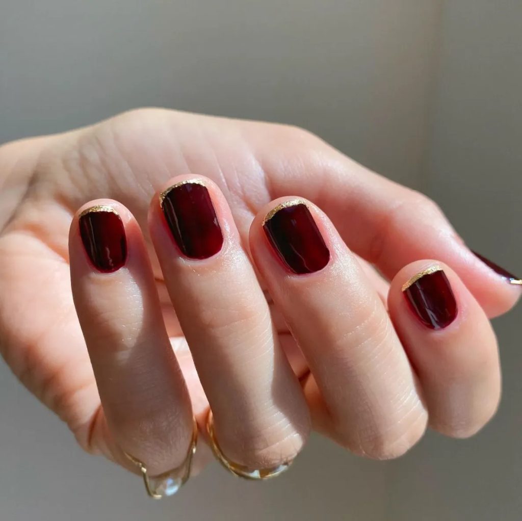 Classy Red Nails With Gold Tips