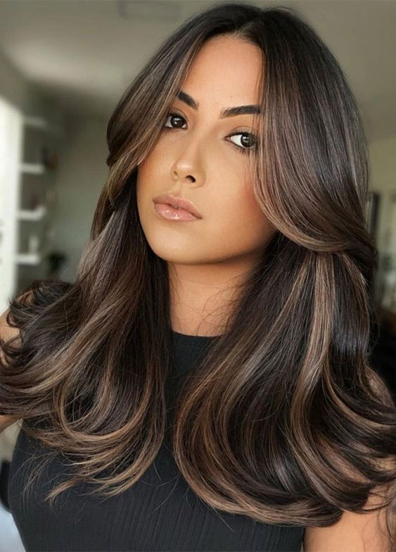 Dark Layered Curls With Caramel Streaks
