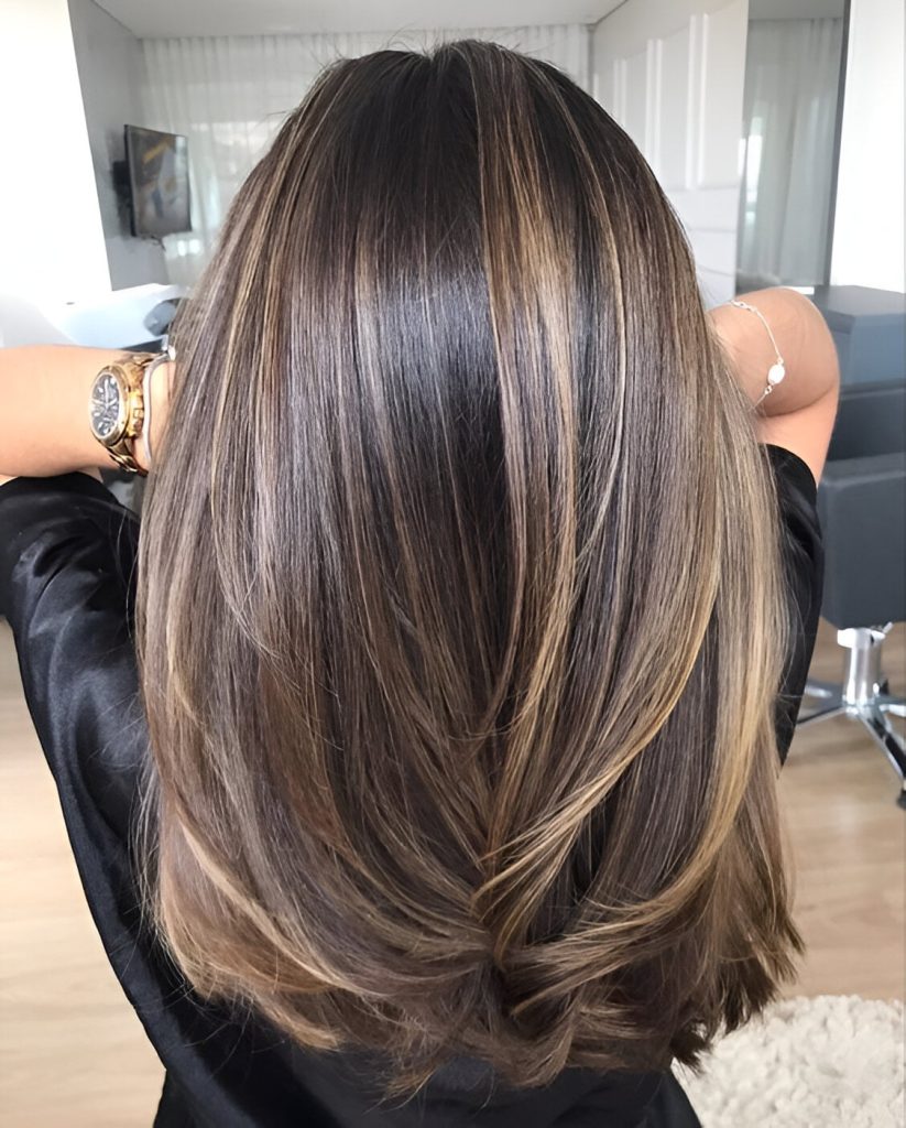 Layered Haircut With Caramel Highlights On Black Hair