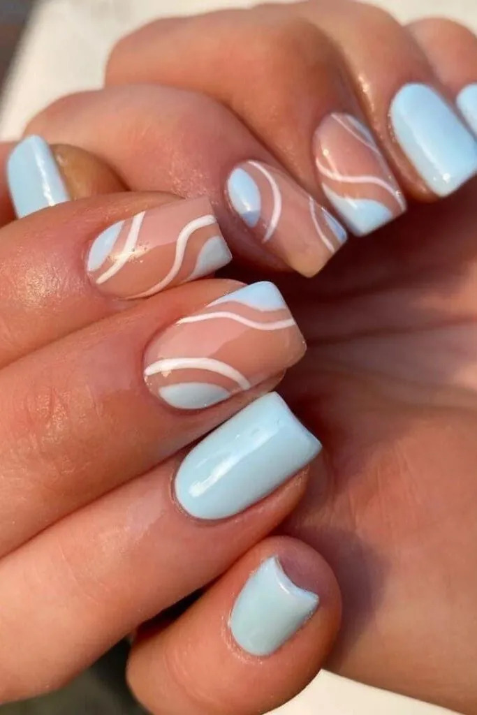Light Blue Nails With Abstract Swirls