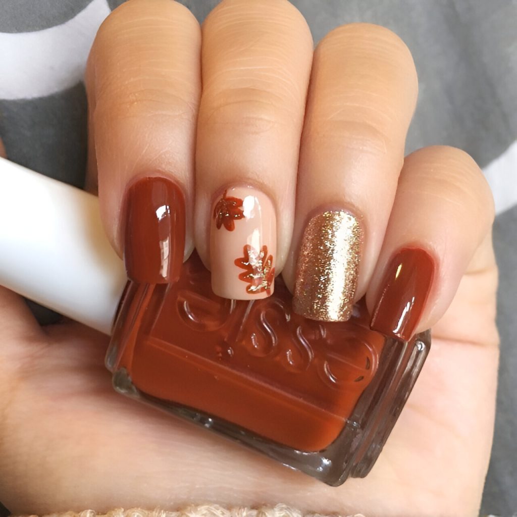 Orange Nails With Gold Glitter