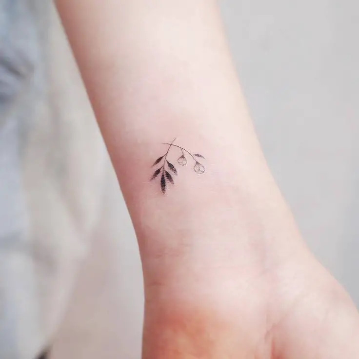 Small Wrist Tattoo with Leaf Design