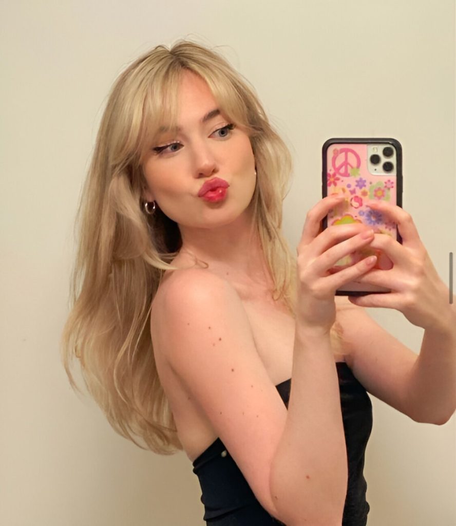 Soft Blonde Layered Hair With Curtain Bangs
