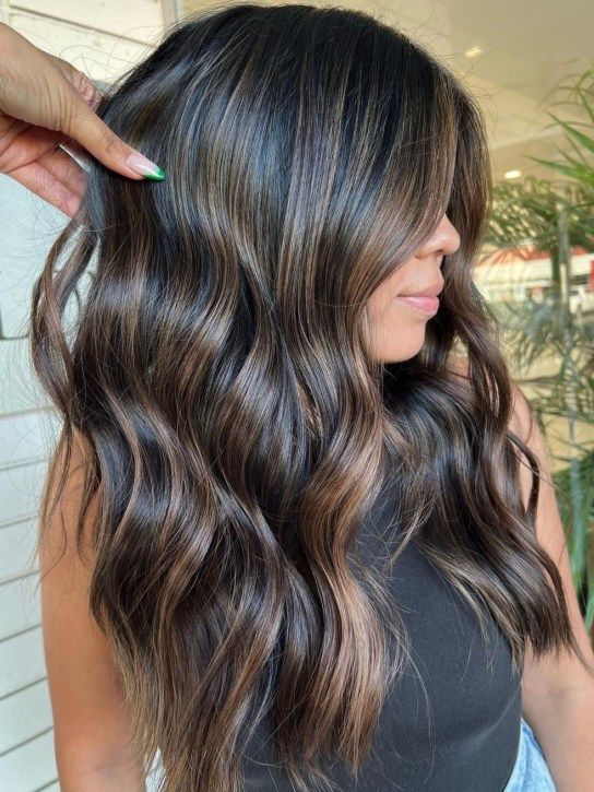 Wavy Medium Hairstyle With Caramel Highlights