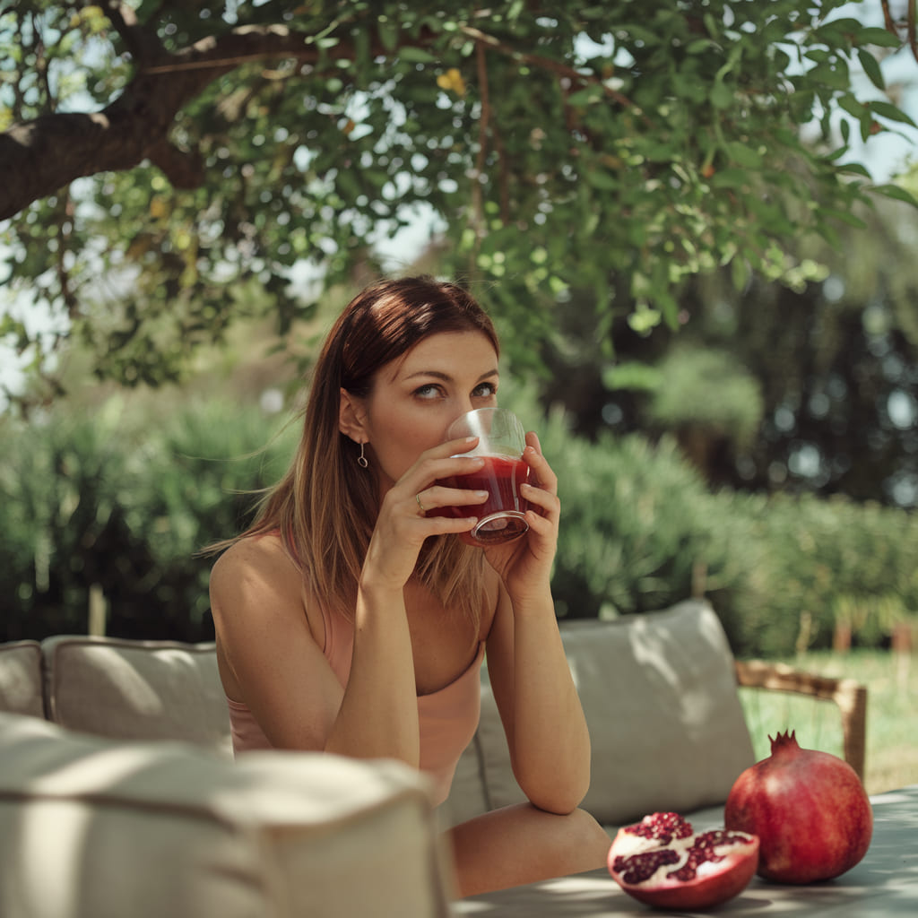 In the world of natural beauty, few ingredients pack as much of a punch as pomegranate. Rich in antioxidants, vitamins, and skin-loving nutrients, it's not just a delicious, refreshing drink, it's also a genuine beauty booster capable of transforming your skin.

Let's explore the beauty benefits of pomegranate juice, walk through some of the best DIY remedies, and share tips for working this natural wonder into your everyday beauty routine.

Ready to see how this juice can level up your skincare? Let's get into it.

Table of Contents
1. Beauty Benefits of Pomegranate Juice for Skin

When it comes to pomegranates, the skin benefits run deep. From supporting a healthy complexion to slowing visible signs of aging, here's why this juice deserves a spot in your routine:

Rich in Antioxidants for Youthful Skin

Pomegranate juice is loaded with antioxidants, especially polyphenols and flavonoids, which help protect skin from damage caused by free radicals. These unstable molecules can contribute to premature aging and wrinkles.

Drinking this juice helps neutralize free radicals, which can slow the aging process and support a more youthful, radiant look.

Supports Skin Hydration

One of pomegranate's standout benefits is its ability to support skin hydration. Proper hydration plays a big role in maintaining elasticity and keeping skin smooth and plump.

It helps replenish moisture, leaving skin feeling nourished and refreshed, which is especially useful for those with dry or dehydrated skin.

Helps Fight Hyperpigmentation and Dark Spots

If dark spots, hyperpigmentation, or acne scars are a concern, pomegranate juice can help. Its vitamin C content supports brighter skin and a more even complexion.

The antioxidants in the juice also help reduce the appearance of dark spots by supporting cell turnover and encouraging skin cell renewal.

Helps Reduce Inflammation and Irritation

Pomegranate offers anti-inflammatory properties that help calm redness and irritation. Whether you're dealing with acne, eczema, or general skin inflammation, pomegranate can help soothe skin and ease flare-ups.

Supports Collagen Production for Firmer Skin

Collagen keeps skin firm, smooth, and youthful, but production naturally slows with age, contributing to sagging and wrinkles.

Pomegranate acts as a natural collagen booster thanks to its high vitamin C content. Drinking it regularly can help support collagen production, contributing to firmer, more youthful looking skin.

2. Best DIY Remedies Using Pomegranate Juice

Now that you know the beauty benefits, here are a few fun, easy DIY remedies to incorporate pomegranate juice into your skincare routine.

Pomegranate Face Mask for Radiant Skin

This hydrating, brightening mask is a great way to give skin an instant glow. Combined with honey, pomegranate juice helps hydrate, soothe, and brighten your complexion.

What you'll need:

2 tablespoons pomegranate juice
1 tablespoon honey
1 teaspoon yogurt (optional, for extra moisture)

How to make it:

Mix the juice, honey, and yogurt (if using) in a small bowl.
Apply the mixture to your face and leave on for 15 to 20 minutes.
Rinse off with lukewarm water, gently massaging your skin as you go.
Pomegranate and Turmeric Scrub for Clear Skin

Turmeric offers strong anti-inflammatory properties that can help reduce acne and brighten skin. Paired with pomegranate juice, this scrub exfoliates, clears away dead skin cells, and helps calm inflammation.

What you'll need:

1 tablespoon pomegranate juice
1 teaspoon turmeric powder
2 tablespoons sugar (or brown sugar)

How to make it:

Mix the juice, turmeric, and sugar together to form a paste.
Apply the scrub to your face using gentle circular motions.
Leave on for 5 to 10 minutes, then rinse off with warm water.
Pomegranate Hydrating Toner

This refreshing toner helps hydrate, balance, and tighten skin, making it a great step before moisturizer or serum.

What you'll need:

¼ cup pomegranate juice
¼ cup rose water
2 tablespoons witch hazel (optional, for acne-prone skin)

How to make it:

Combine the juice, rose water, and witch hazel (if using) in a small bottle or jar.
Shake well before each use.
After cleansing, apply the toner to your face with a cotton pad.
3. Ways to Work Pomegranate Juice Into Your Daily Routine

Beyond DIY beauty remedies, there are other simple ways to add pomegranate juice to your day for glowing skin and overall wellness:

Drink It Daily: For the most direct skin benefits, a daily glass of pomegranate juice is an easy way to reap its rewards.
Blend It Into Smoothies: Add pomegranate juice to your favorite smoothie for a nutrient-rich drink that supports beauty from within.
Use It as a Skin Elixir: A few drops mixed into your regular moisturizer or serum can add an extra antioxidant and brightening boost to your routine.
4. Why Pomegranate Juice Deserves a Spot in Your Skincare Routine

When it comes to beauty, pomegranate is a real powerhouse ingredient capable of making a noticeable difference in your skin. From its high vitamin C content to its rich antioxidant profile, pomegranate juice helps soften wrinkles, fight acne, and support overall skin health.

Its natural collagen-boosting and anti-inflammatory qualities also make it a great option for improving skin tone and texture.

Adding pomegranate to your routine, whether by drinking it or using it in DIY remedies, is a simple, natural way to work toward healthier, glowing skin.

5. Disclaimer

The information in this article is intended for general informational purposes only. Always patch test new ingredients before applying them to your skin, and consult a dermatologist if you have sensitive skin or an underlying condition.

From boosting collagen production to hydrating and brightening your complexion, pomegranate juice is a true beauty powerhouse. Add this natural elixir to your routine today and see the difference for yourself.